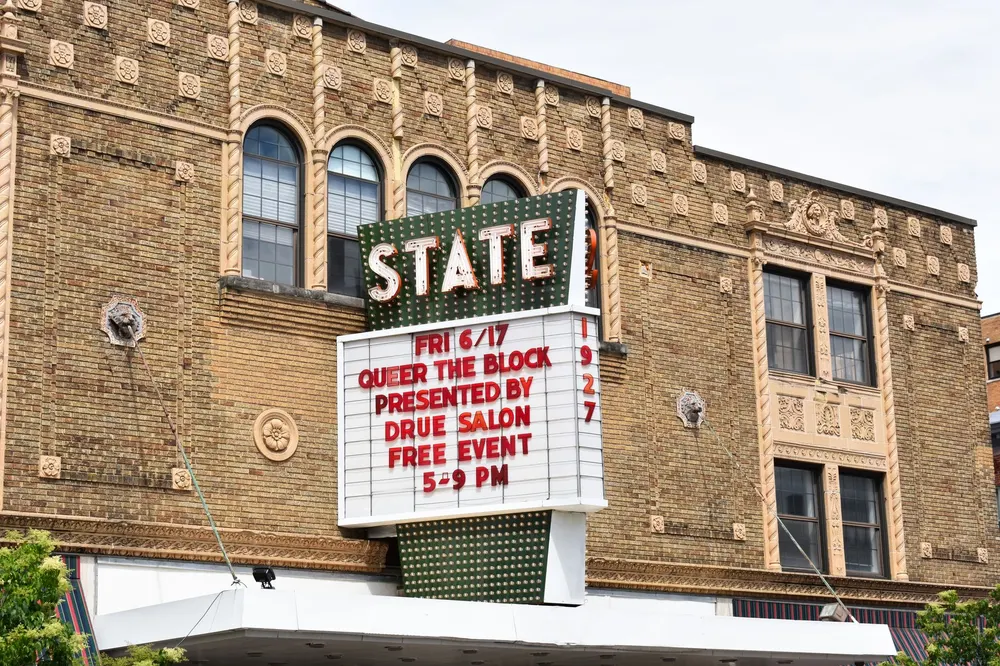 The State Theatre's ornate tan brick facade and marquee in downtown Kalamazoo